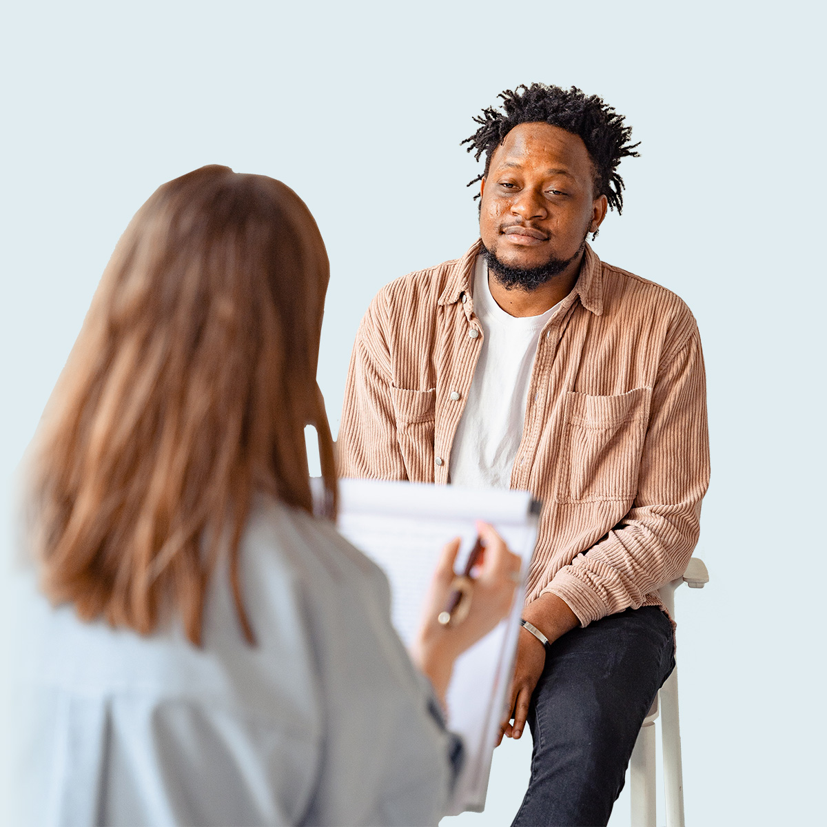 Black man in counseling session with doctor