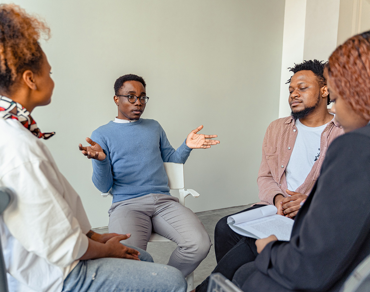 Black man in counseling session with doctor