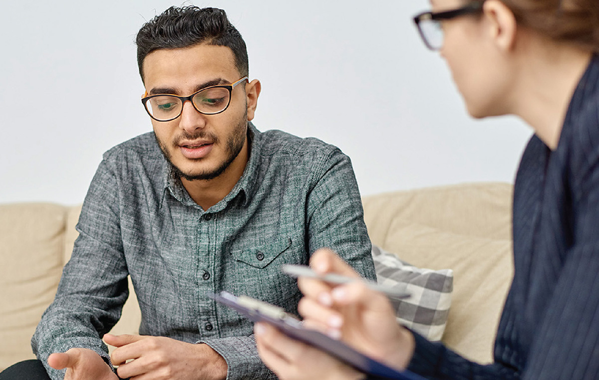 Black man in counseling session with doctor