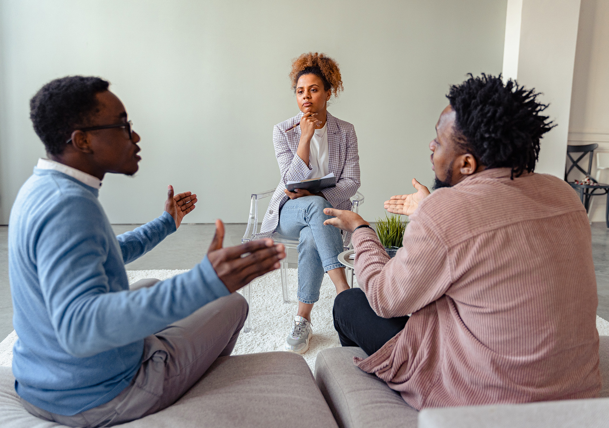 Black man in counseling session with doctor